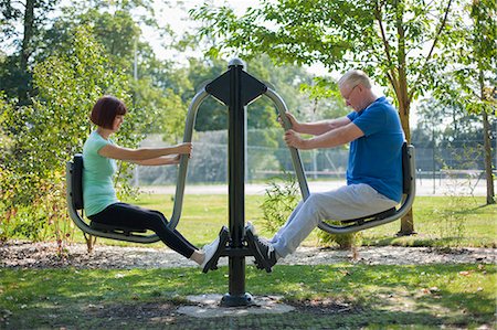 Older couple using exercise equipment Stock Photo - Premium Royalty-Free, Code: 649-06433612