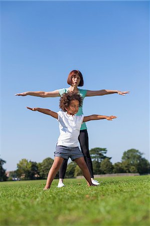 stretching together - Older woman playing with granddaughter Stock Photo - Premium Royalty-Free, Code: 649-06433624