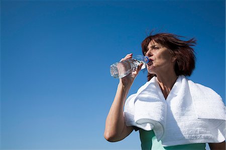 fit older woman - Older woman drinking water bottle Stock Photo - Premium Royalty-Free, Code: 649-06433620