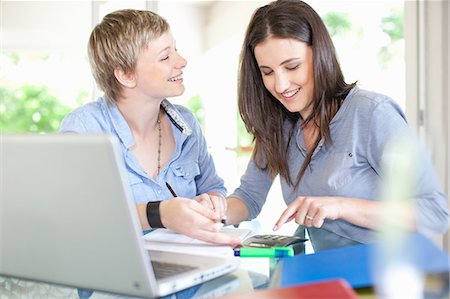 simsearch:649-06305004,k - Women working together at desk Stock Photo - Premium Royalty-Free, Code: 649-06488419