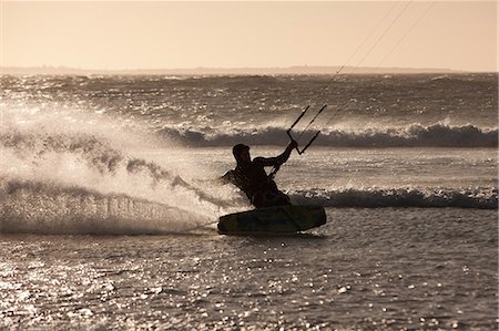 single caucasian male 25 years old active - Man windsurfing in waves Stock Photo - Premium Royalty-Free, Code: 649-06488489