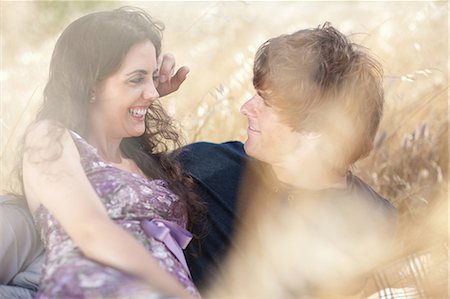 Couple relaxing in tall grass Stock Photo - Premium Royalty-Free, Code: 649-06488508