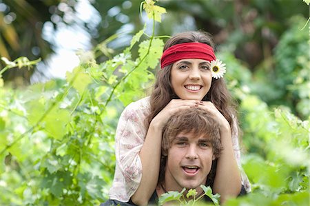 piggyback ride in the garden - Man carrying girlfriend in tall plants Stock Photo - Premium Royalty-Free, Code: 649-06488500