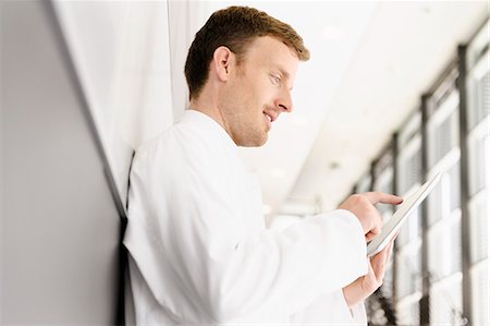 science work one - Doctor using tablet computer Stock Photo - Premium Royalty-Free, Code: 649-06488638