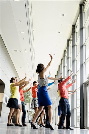 Business people dancing in office Stock Photo - Premium Royalty-Free, Code: 649-06488716
