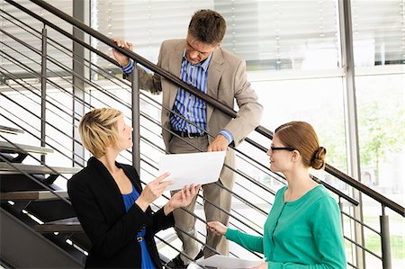 stairs with window - Business people talking in office Stock Photo - Premium Royalty-Free, Code: 649-06488751