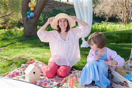 playing with daughter in garden - Mother and daughter having picnic Stock Photo - Premium Royalty-Free, Code: 649-06489027