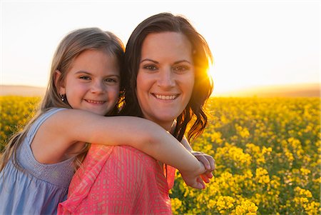 flowers summer - Mother and daughter hugging outdoors Stock Photo - Premium Royalty-Free, Code: 649-06489097