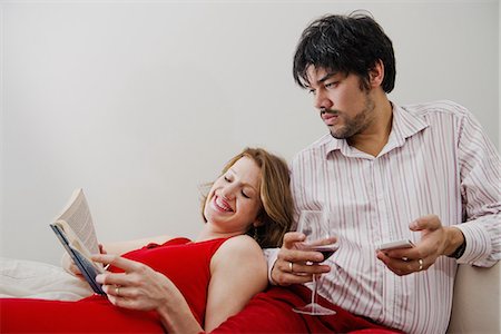Couple relaxing on sofa together Stock Photo - Premium Royalty-Free, Code: 649-06489369