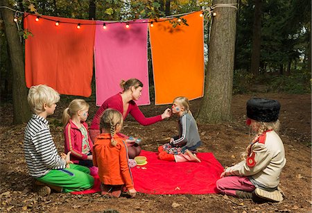 painting of boy kneeling - Childrens theater improvised in woods Stock Photo - Premium Royalty-Free, Code: 649-06489435