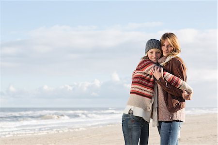 friend (female) - Smiling women hugging on beach Stock Photo - Premium Royalty-Free, Code: 649-06489711