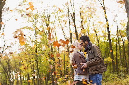 simsearch:614-06624984,k - Smiling couple kissing in forest Stock Photo - Premium Royalty-Free, Code: 649-06489783