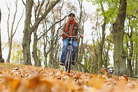 path fall tree - Man riding bicycle in park Stock Photo - Premium Royalty-Free, Code: 649-06489807