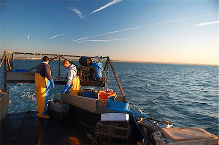 fishing boat man fishing - Fishermen at work on boat Stock Photo - Premium Royalty-Free, Code: 649-06489852