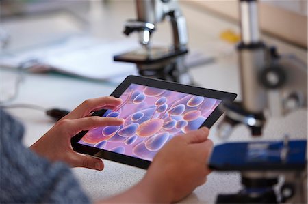 Student using tablet computer in class Stock Photo - Premium Royalty-Free, Code: 649-06489960