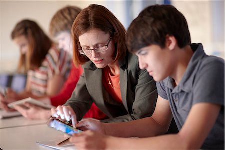 eyeglasses teenager boy - Student and teacher with tablet computer Stock Photo - Premium Royalty-Free, Code: 649-06489986