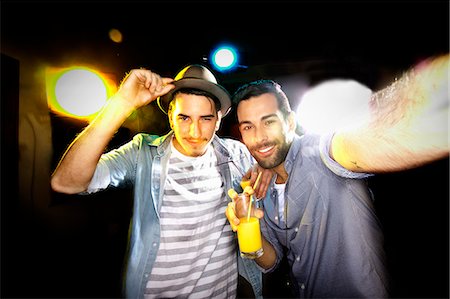 party - Smiling men taking picture together Stock Photo - Premium Royalty-Free, Code: 649-06490073