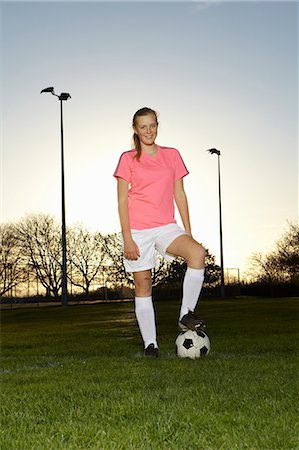 soccer player female standing - Football player standing with ball Stock Photo - Premium Royalty-Free, Code: 649-06490125