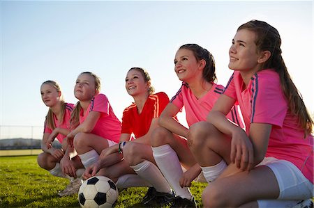 squat - Football team smiling together in field Stock Photo - Premium Royalty-Free, Code: 649-06490141