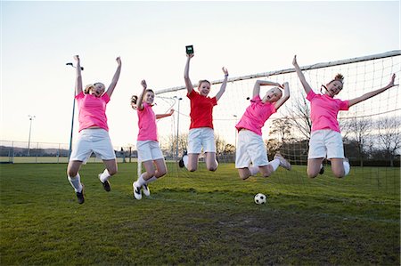 soccer jump - Football team cheering in field Stock Photo - Premium Royalty-Free, Code: 649-06490150