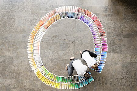 picture of woman kneeling down from behind - Business people examining paint swatches Stock Photo - Premium Royalty-Free, Code: 649-06532591