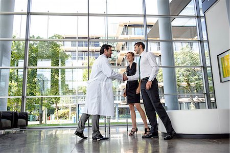 Doctor and businessman shaking hands Stock Photo - Premium Royalty-Free, Code: 649-06532615