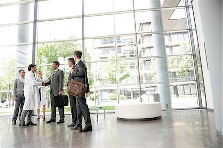 sales man in business suit - Doctors and businessmen meeting Stock Photo - Premium Royalty-Free, Code: 649-06532622