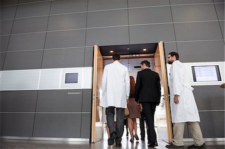 doctor walking - Business people and doctors in office Stock Photo - Premium Royalty-Free, Code: 649-06532636