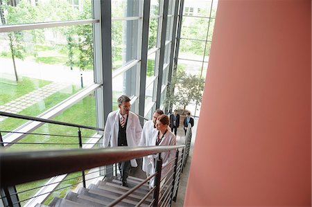 Doctors climbing staircase in office Stock Photo - Premium Royalty-Free, Code: 649-06532643