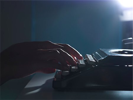 desk dark - Close up of woman using typewriter Stock Photo - Premium Royalty-Free, Code: 649-06532752