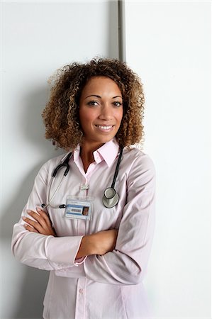 doctor eye contact - Doctor wearing stethoscope in hospital Stock Photo - Premium Royalty-Free, Code: 649-06532775