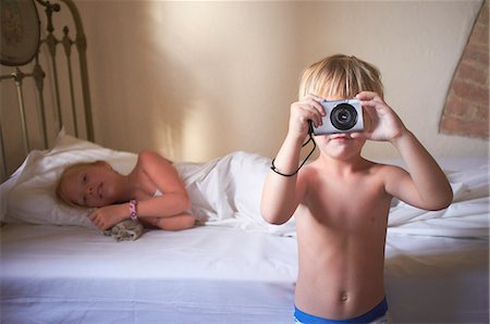 family italy - Boy taking picture in bedroom Stock Photo - Premium Royalty-Free, Code: 649-06532786