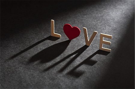 Letters spelling 'love casting shadow Stock Photo - Premium Royalty-Free, Code: 649-06532925