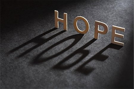 Letters spelling 'hope casting shadow Stock Photo - Premium Royalty-Free, Code: 649-06532926