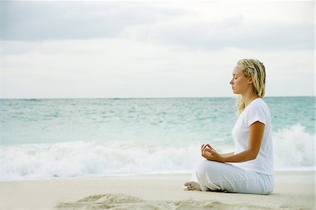 paradise island bahamas beach - Woman meditating on tropical beach Stock Photo - Premium Royalty-Free, Code: 649-06532958