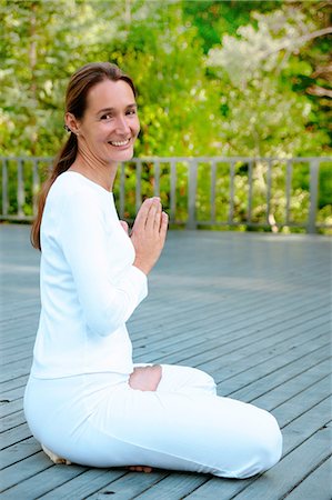 sitting yoga pose outside - Woman practicing yoga outdoors Stock Photo - Premium Royalty-Free, Code: 649-06532987