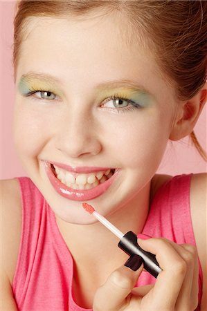 Smiling girl wearing colorful makeup Stock Photo - Premium Royalty-Free, Code: 649-06533096