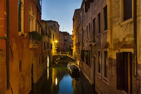 simsearch:614-09027173,k - Rowboat and buildings on urban canal Stock Photo - Premium Royalty-Free, Code: 649-06533221