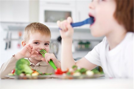 Children eating together at table Stock Photo - Premium Royalty-Free, Code: 649-06533361