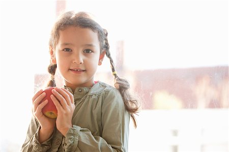 simsearch:649-06352656,k - Girl holding apple by window Stock Photo - Premium Royalty-Free, Code: 649-06533525