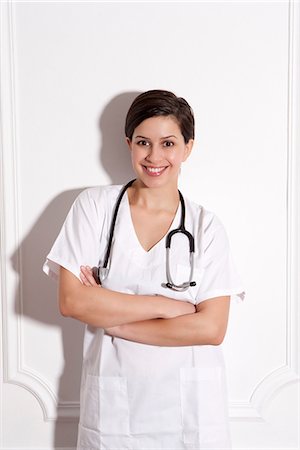 doctor woman scrubs confident - Doctor wearing stethoscope in office Stock Photo - Premium Royalty-Free, Code: 649-06621962