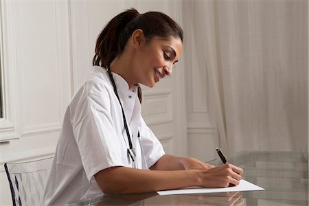 simsearch:649-06622004,k - Doctor taking notes in office Stock Photo - Premium Royalty-Free, Code: 649-06622005