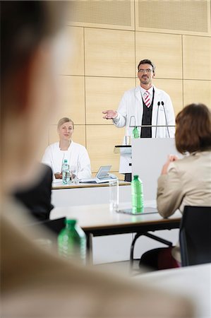 simsearch:649-06041268,k - Doctors giving talk in conference room Stock Photo - Premium Royalty-Free, Code: 649-06622075