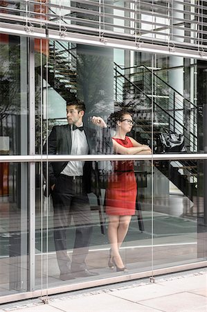 simsearch:6122-07693912,k - Couple looking out window Stock Photo - Premium Royalty-Free, Code: 649-06622110