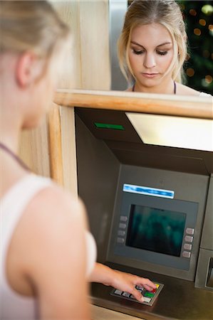 people at atm - Woman using keypad on ATM Stock Photo - Premium Royalty-Free, Code: 649-06622174