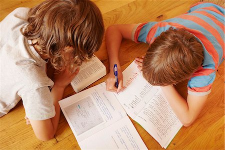 students studying top view - Boys studying together on floor Stock Photo - Premium Royalty-Free, Code: 649-06622422
