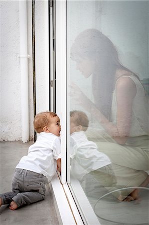 family playing outdoors parent ethnic not beach not park - Mother and son playing in door Stock Photo - Premium Royalty-Free, Code: 649-06622553