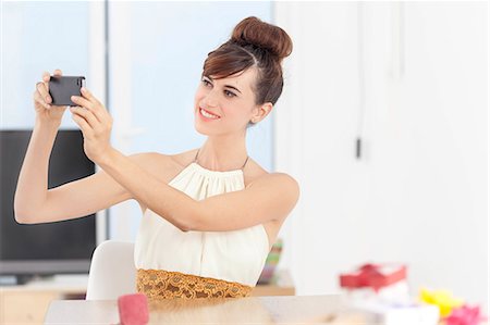 selfie cell phone indoor - Woman taking picture with cell phone Stock Photo - Premium Royalty-Free, Code: 649-06622564