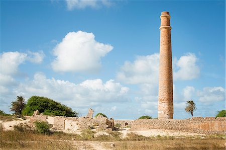 Smokestack over stone ruins Fotografie stock - Premium Royalty-Free, Codice: 649-06622619