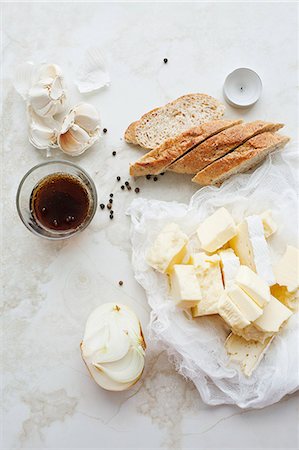 still life of food - Sliced bread, butter and garlic Stock Photo - Premium Royalty-Free, Code: 649-06622639